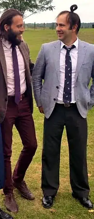 David Baker (left) and Jim Baker (right) in jackets and ties at an outdoor wedding